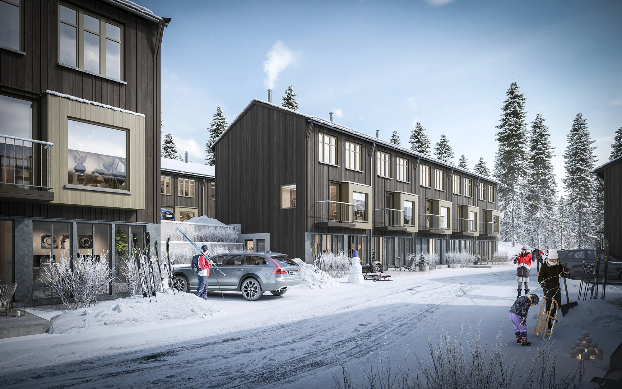Gårdsgata mellan radhusen i vinterskymning.